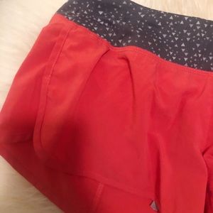 Neon pink and grey Nike shorts